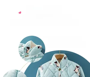 Detail of light blue quilted thermal shoulder wrap with detachable collar and fox pattern