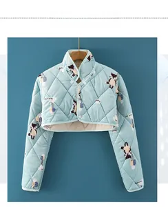 Detailed view of light blue quilted thermal shoulder wrap with cute cat patterns