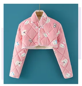Detail of pink quilted fleece shoulder warmer with cartoon rabbit pattern and soft plush lining