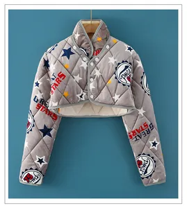 Close-up of quilted grey shoulder warmer with thick fleece lining and star pattern