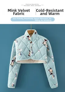 Detail of light blue quilted mink velvet shoulder warmer with cartoon cat print and buttons