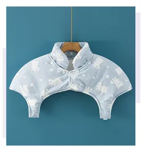 Detailed view of thick quilted baby shoulder warmer with cute bear patterns and snap buttons