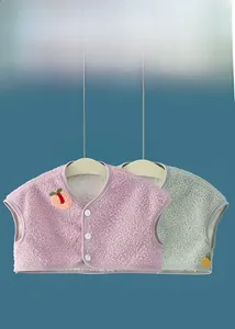 Detailed view of warm milk fleece shoulder protector vests with fruit embroidery and buttons