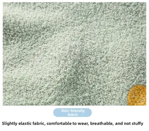 Close-up of soft light green fleece fabric with skin-friendly and breathable texture