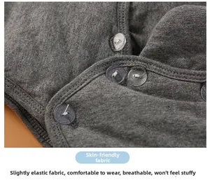 Detailed macro shot of grey knitted fabric with resin buttons, skin-friendly and breathable