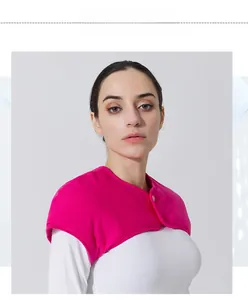 Detail view of the rose pink thermal fleece shoulder warmer with single button closure
