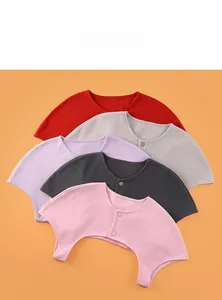 Detail showing five different colors of soft thermal shoulder warmers with button closure