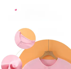 Detailed view of pink thermal shoulder warmer with soft fleece fabric and snap button closure