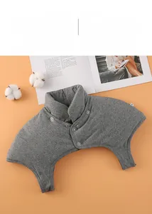 Close-up of grey thermal shoulder protector with high neck collar and button closure