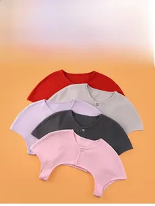 Detailed view of colorful velvet thermal shoulder warmers with front button closure