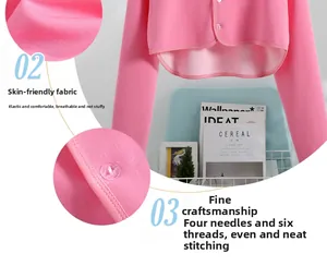 Detail of pink thermal shoulder warmer with flatlock stitching and pearl buttons