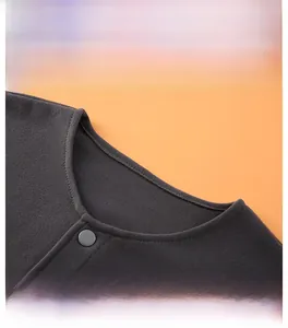 Close-up of thermal fleece shoulder wrap featuring a round neck and matte snap button