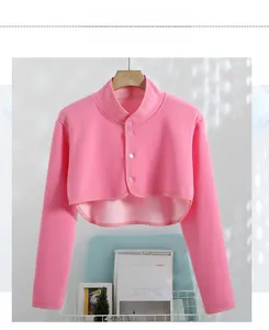 Detail view of pink fleece shoulder warmer with stand collar and round buttons