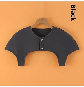Close-up of thin black shoulder protector with metal buttons for neck warmth