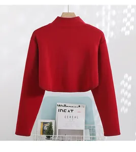 Detail of red fleece-lined warming shoulder wrap showing its high-quality thick fabric