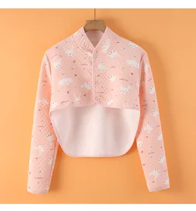 Detail of pink quilted shoulder protector with cute animal prints and button closure