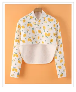 Close-up of quilted thermal shoulder protector with lemon print and button closure