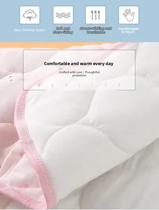 Close-up of soft quilted pink cotton shoulder warmer with cute rabbit pattern for women