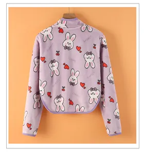 Detail of lavender fleece shoulder protector with rabbit heart pattern and warm plush texture