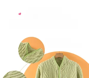 Detail of light green thermal fleece shoulder wrap with V-neck and white button design