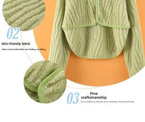 Detail of light green fleece shoulder wrap showing striped texture and seamless stitching