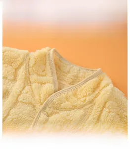 Detail of soft yellow flannel shoulder protector with high collar and reinforced edging
