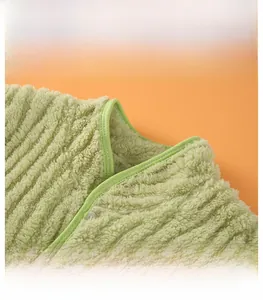Detail of the stand collar on a warm green flannel shoulder protector with soft texture