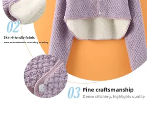 Detail of purple fleece shoulder wrap showing soft inner lining and button closures