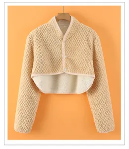 Close-up of beige thermal shoulder protector with honeycomb fleece and cozy sherpa lining