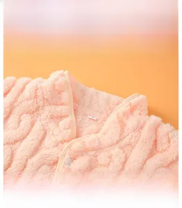Close-up of a pink fleece shoulder protector with a windproof stand-up collar design