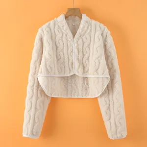 Creamy white plush knitted shoulder wrap vest with cable knit texture for winter warmth