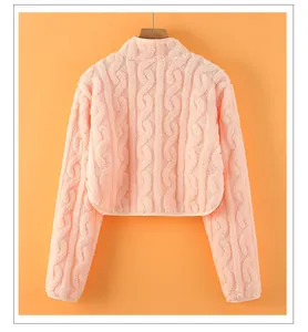 Detail of light pink plush shoulder warmer featuring a cable knit texture and stand collar