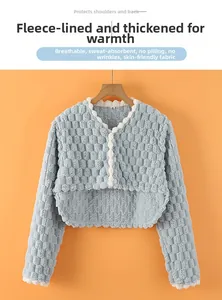 Close-up of thick light blue thermal shoulder wrap featuring bubble texture and soft fleece