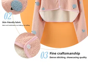 Detail of pink fleece neck warmer with blue dots, soft texture and durable stitching