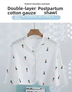 Detail of white double-layer cotton gauze shoulder wrap with cute carrot prints and buttons