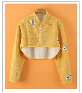 Close-up of yellow fleece shoulder warmer with cartoon rabbit pattern and L size tag