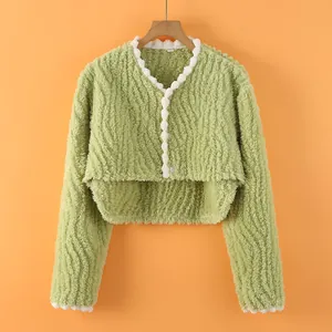 Green fleece shoulder protector jacket with white wavy lace trim and thick warm fabric