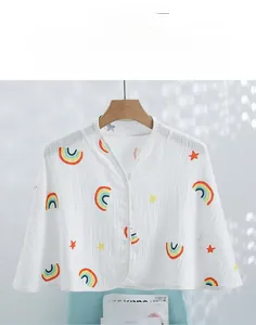 Close-up of double-layer cotton nursing shawl with colorful rainbow and star patterns