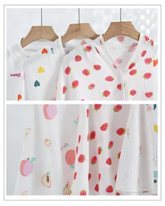 Close-up of soft double-layer cotton gauze shawl with cute strawberry and peach patterns