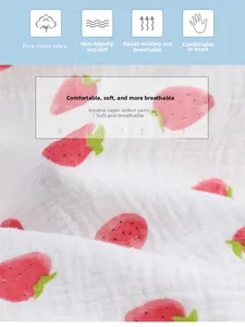 Close-up of soft double-layer cotton gauze fabric with cute strawberry print pattern