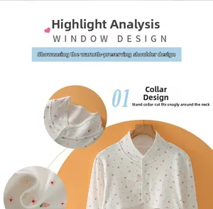 Detailed view of the strawberry print cotton shoulder warmer with neck button closure