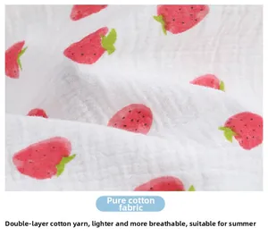 Close-up of double-layer cotton gauze fabric with strawberry print for soft nursing shawl