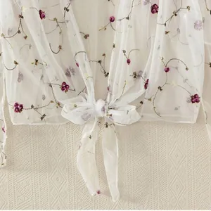 Elegant white mesh sunscreen shawl with floral embroidery and front bow tie design