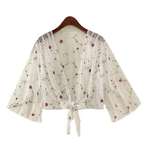 Short mesh cardigan for women with purple floral embroidery and bell sleeves on white background