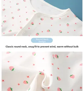 Close-up of baby shoulder wrap with round neck and cute strawberry floral print pattern