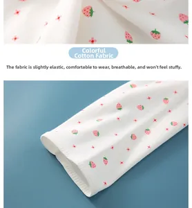 Detail of soft strawberry print cotton fabric with breathable texture and elastic cuffs