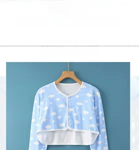Detailed view of sky blue nursing shoulder protector with white cloud patterns