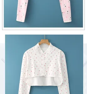 Detailed view of kids' cotton pajamas with cute strawberry buttons and koala patterns