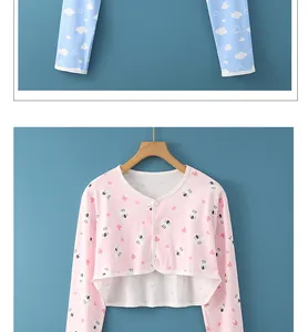 Close-up of pink cotton nursing shoulder wrap and blue trousers with cloud pattern