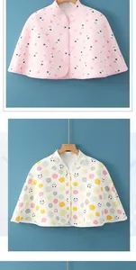 Detail of quilted cotton maternity shoulder wrap with button closure and heart patterns